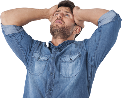 Stressed man in a denim shirt holding his head, promoting a guide from timeshare exit specialists